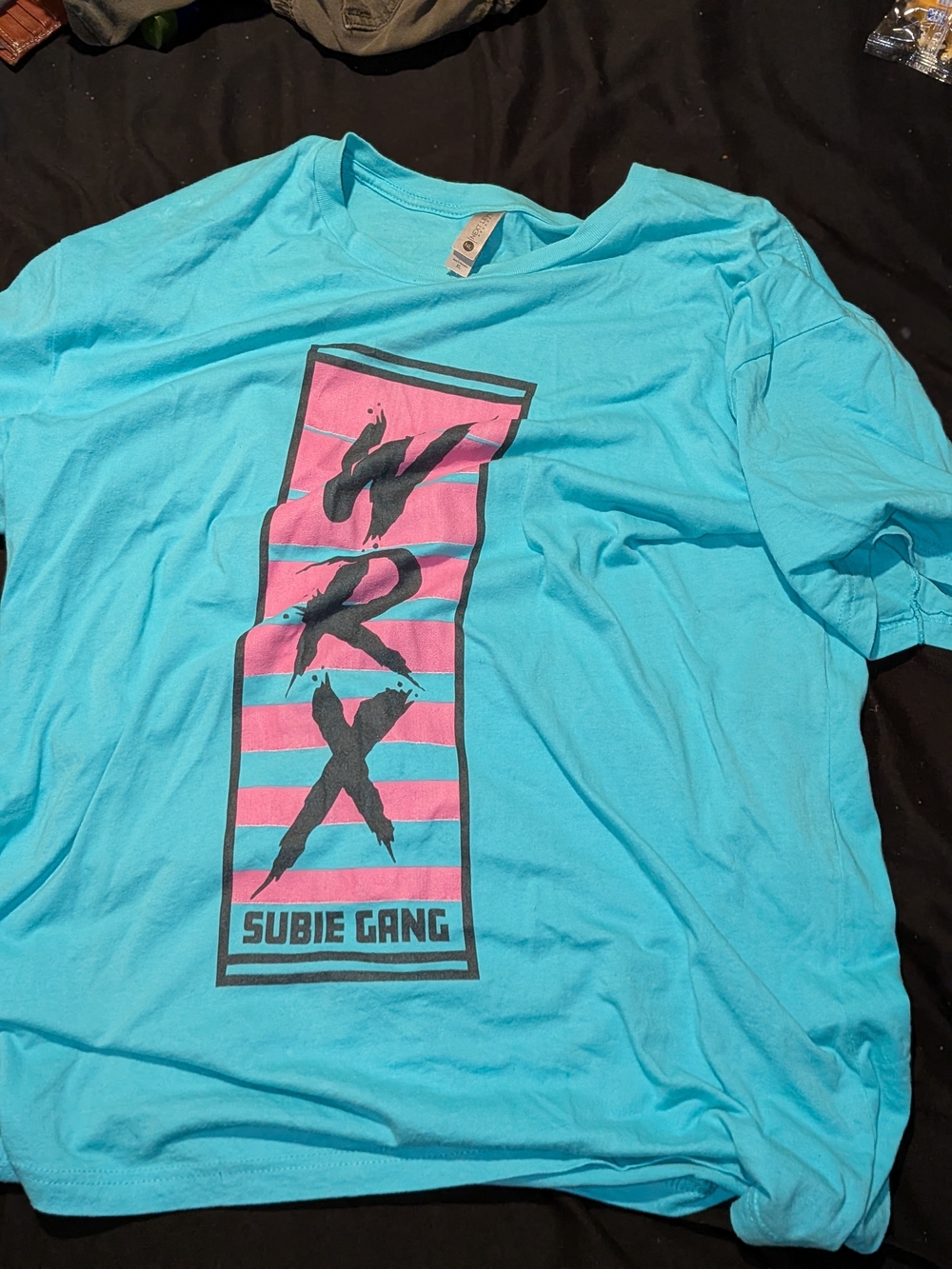 Next Level Apparel Turquoise Tee with Pink & Black Graphic